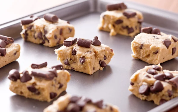 Uncooked cookie dough on a baking pan — Stock Photo, Image