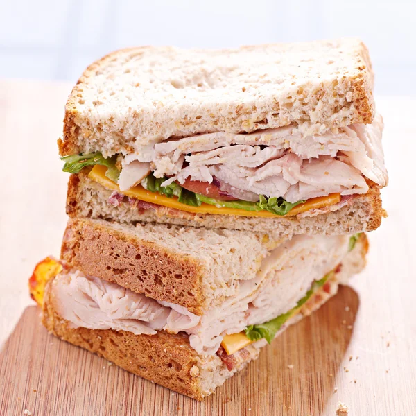 A turkey club sandwhich cut in halves with selective focus — Stock Photo, Image