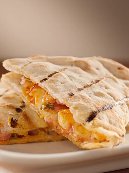 stock image Plate of chicken and cheese quesadillas with copyspace.