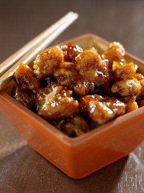 General tso's chicken in a bowl. clipart