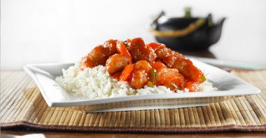 Sweet and sour pork on rice wide shot clipart