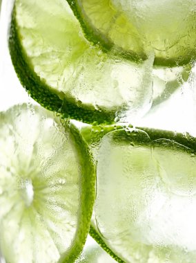 Lime slices in ice macro clipart