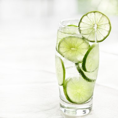 Lime drink with ice and copyspace clipart