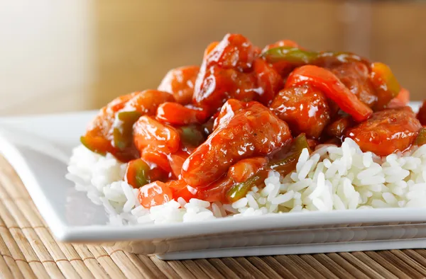 Sweet and sour pork on rice — Stock Photo, Image