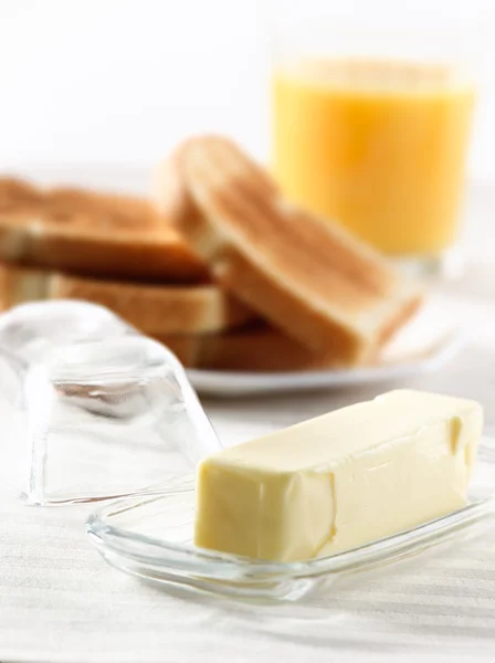 Stick of butter at breakfast — Stock Photo, Image