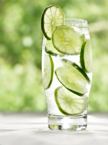 Lime drink with ice on a table — Stock Photo, Image