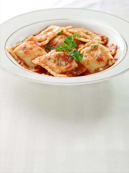 Ravioli pasta with parsley garnish with copy space below — Stock Photo, Image