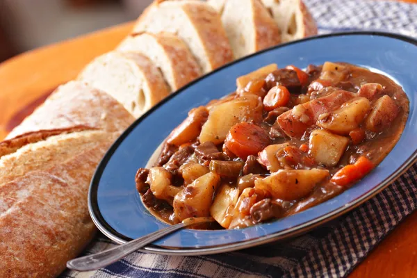 Beef stew with bread loaf — Stock Photo, Image