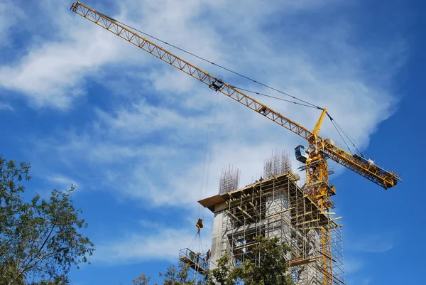 stock image The work of a tower crane on erection of the cathedral