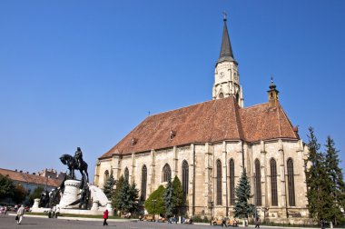 Statue of Matthias Corvinus and St. Michael's Church. clipart