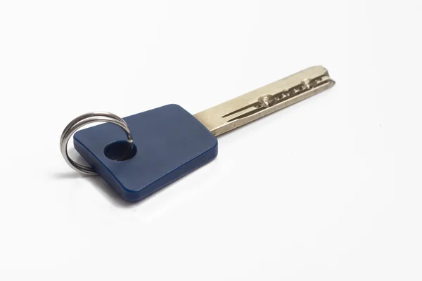 Key on a white background — Stock Photo, Image