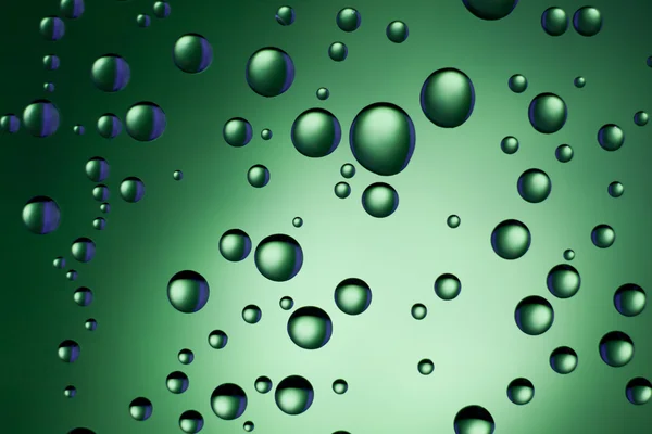 Gotas de agua en verde — Foto de Stock