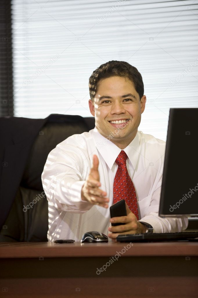 Hispanic Business Man Extending Hand