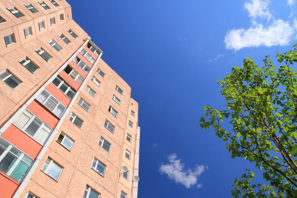 Stock image Facade of skyscraper with apartments with blue sky