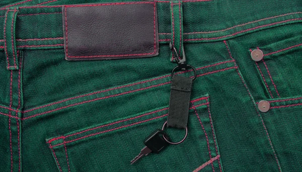 Jeans with label and key — Stock Photo, Image