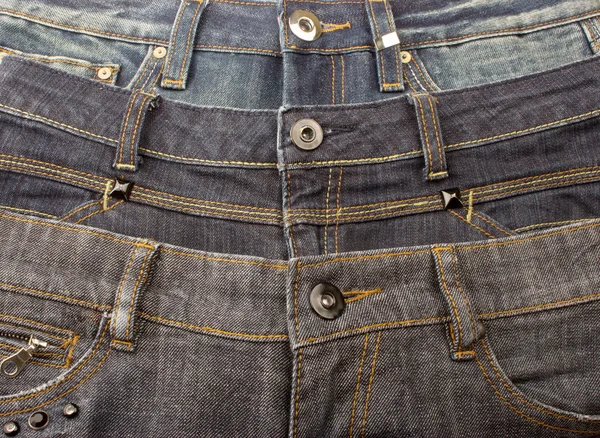 Tři dvojice džíny — Stock fotografie
