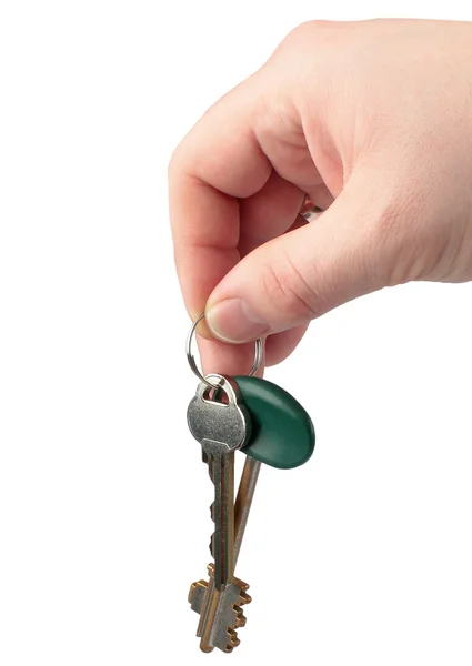 stock image Keys in a hand isolated on white.