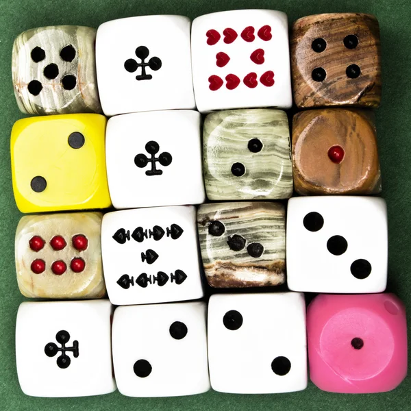 16 Dices on green backround — Stock Photo, Image