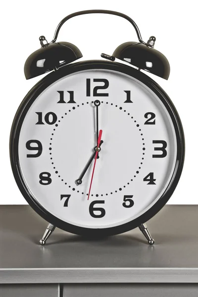 Black alarm clock: seven o'clock — Stock Photo, Image