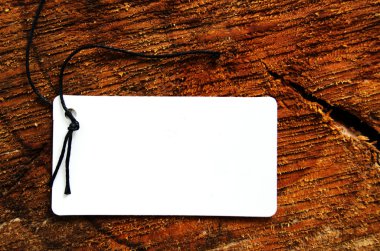 Empty tag on wooden background clipart