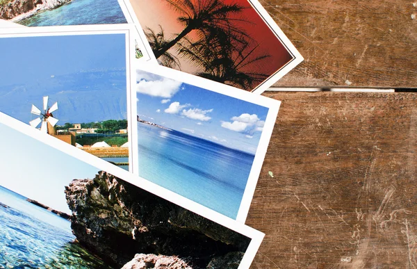 Postcards over an old wooden table — Stock Photo, Image