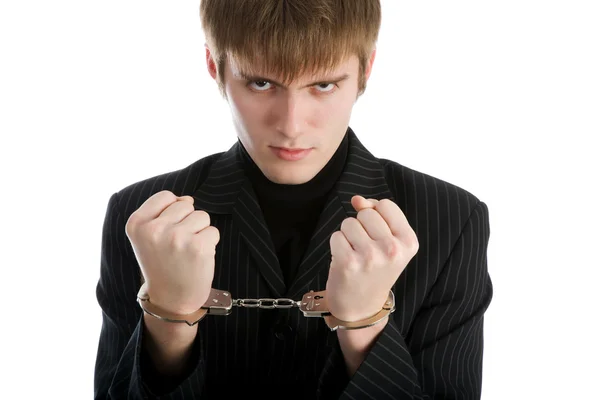 Worried caucasian middle aged businessman in handcuffs . Studio shot. White — Stock Photo, Image