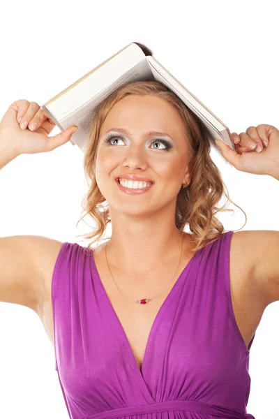 Mädchen mit einem Buch auf dem Kopf — Stockfoto