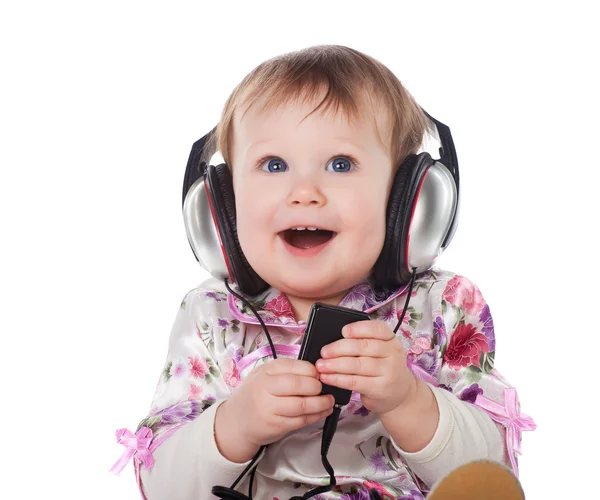 Усміхнена дитина з навушниками — стокове фото