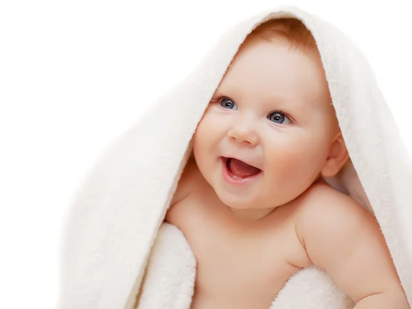 A beautiful smiling baby wrapped in quilt — Stock Photo, Image