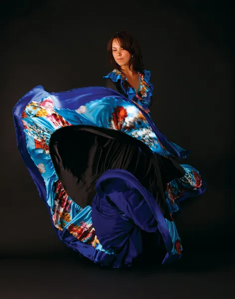 Studio portrait of young attractive woman dancing — Stock Photo, Image