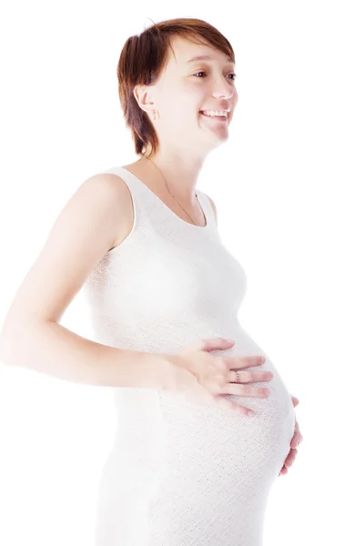 Mulher caucasiana que está grávida de 9 meses em fundo branco — Fotografia de Stock