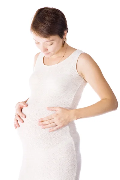 Kaukasische Frau, die im neunten Monat schwanger ist, auf weißem Hintergrund — Stockfoto