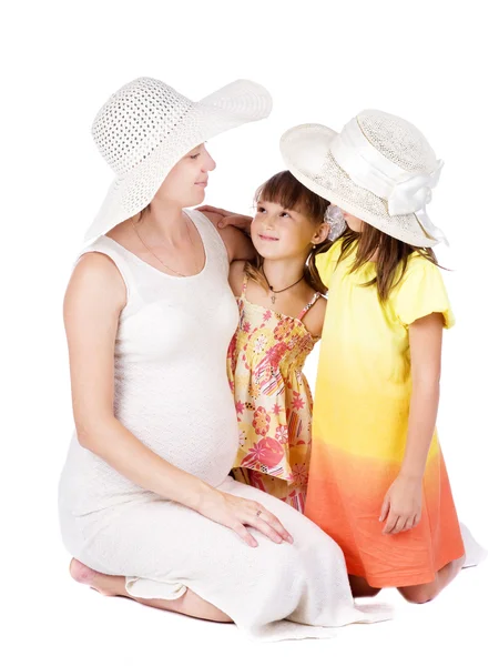 Mother and daughters on the white — Stock Photo, Image