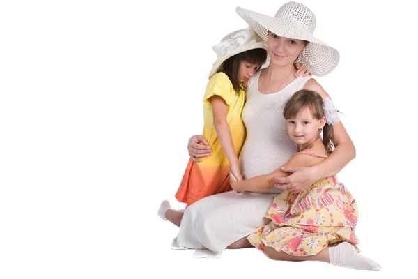 Mother and daughters on the white — Stock Photo, Image