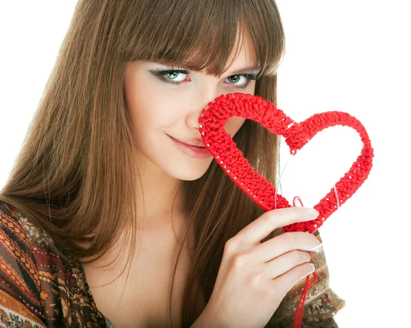 Young blond with a red knit heart — Stock Photo, Image