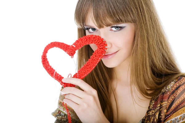 Young blond with a red knit heart — Stock Photo, Image