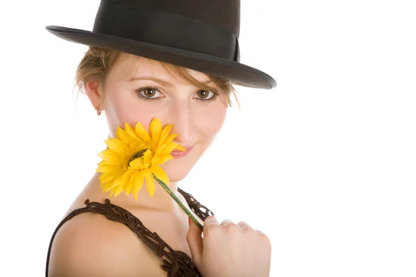 Jonge aantrekkelijke vrouw met gele bloem lachende — Stockfoto