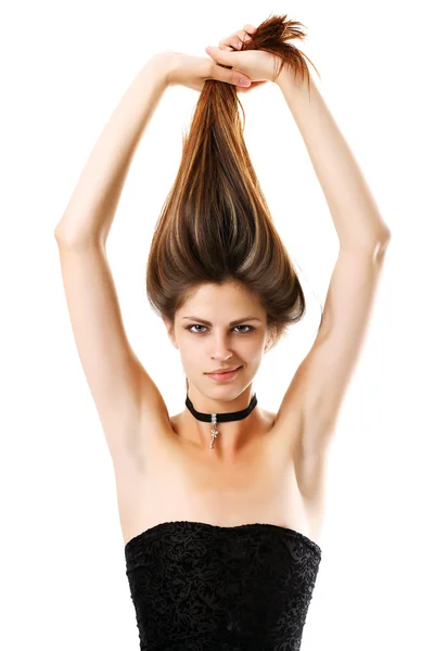 Hübsche Mädchen zieht ihre Haare mit seinen Händen. isoliert — Stockfoto