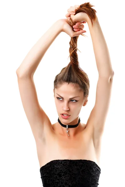 Pretty girl pulls her hair with his hands. Isolated — Stock Photo, Image