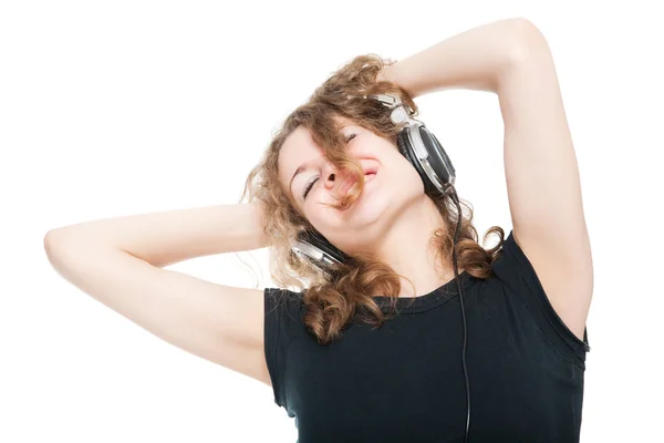 Lächelndes Mädchen mit Kopfhörern, das seine Musik genießt — Stockfoto