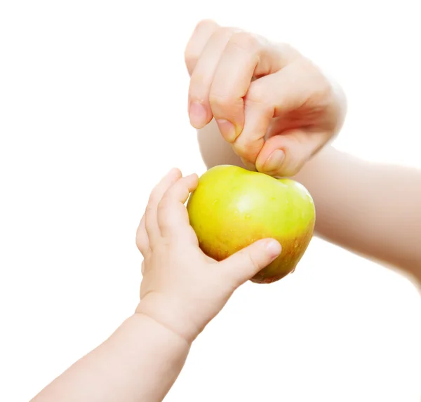 Mam and baby 's hands with apple — стоковое фото