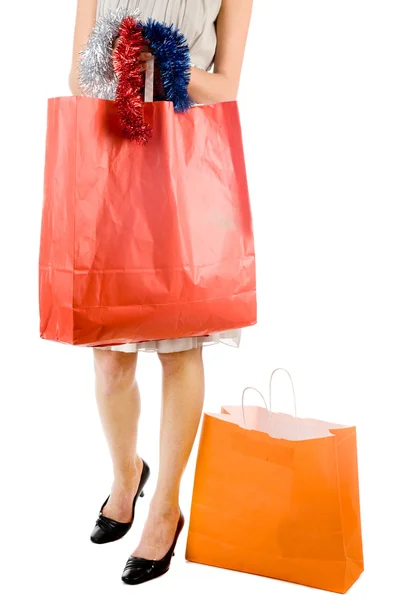 Chica con bolsa de compras en el fondo blanco — Foto de Stock