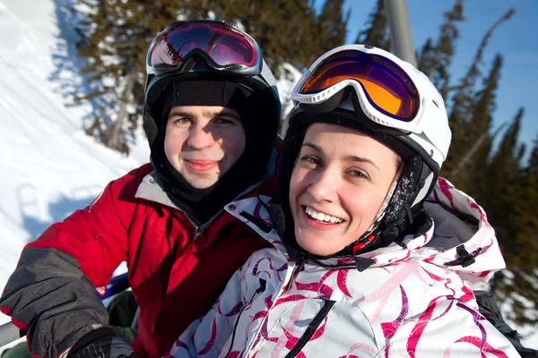 Happy snowboarding team in winter mountains — Stock Photo, Image