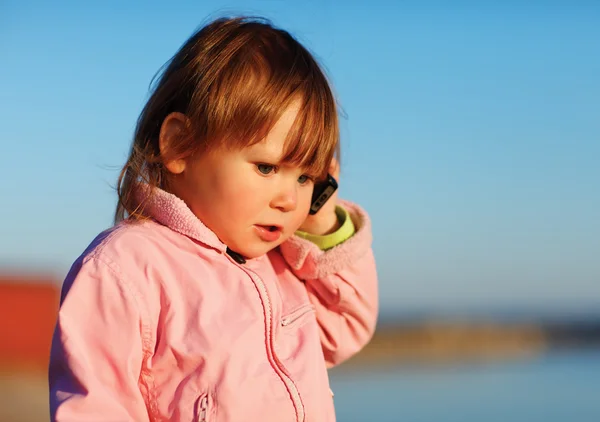 Little girl with phone — Stock Photo, Image