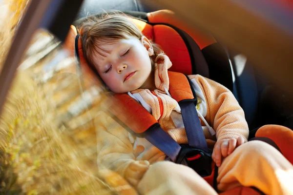 Baby girl in car — Stock Photo, Image