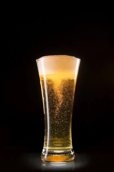 Beer glass with bubbles whirl — Stock Photo, Image