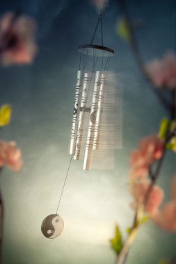 Chinese wind chimes with sakura flowers clipart