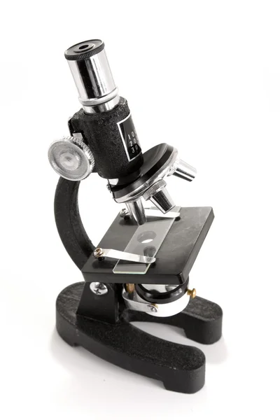 Svart mikroskopet isolerad på vit bakgrund — Stockfoto