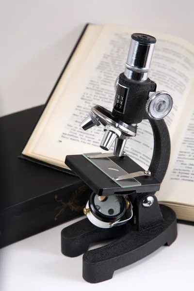 stock image Science concept microscope and books