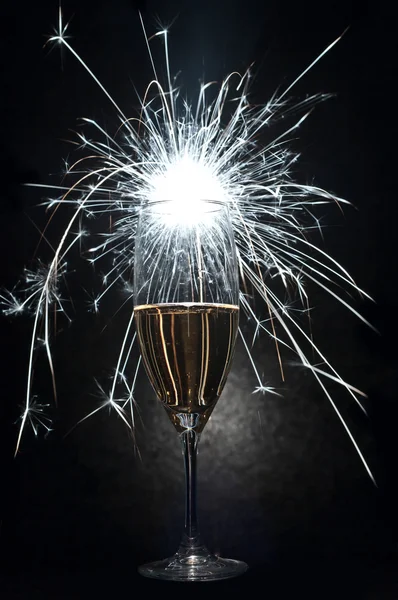 Celebration with champagne and fireworks — Stock Photo, Image